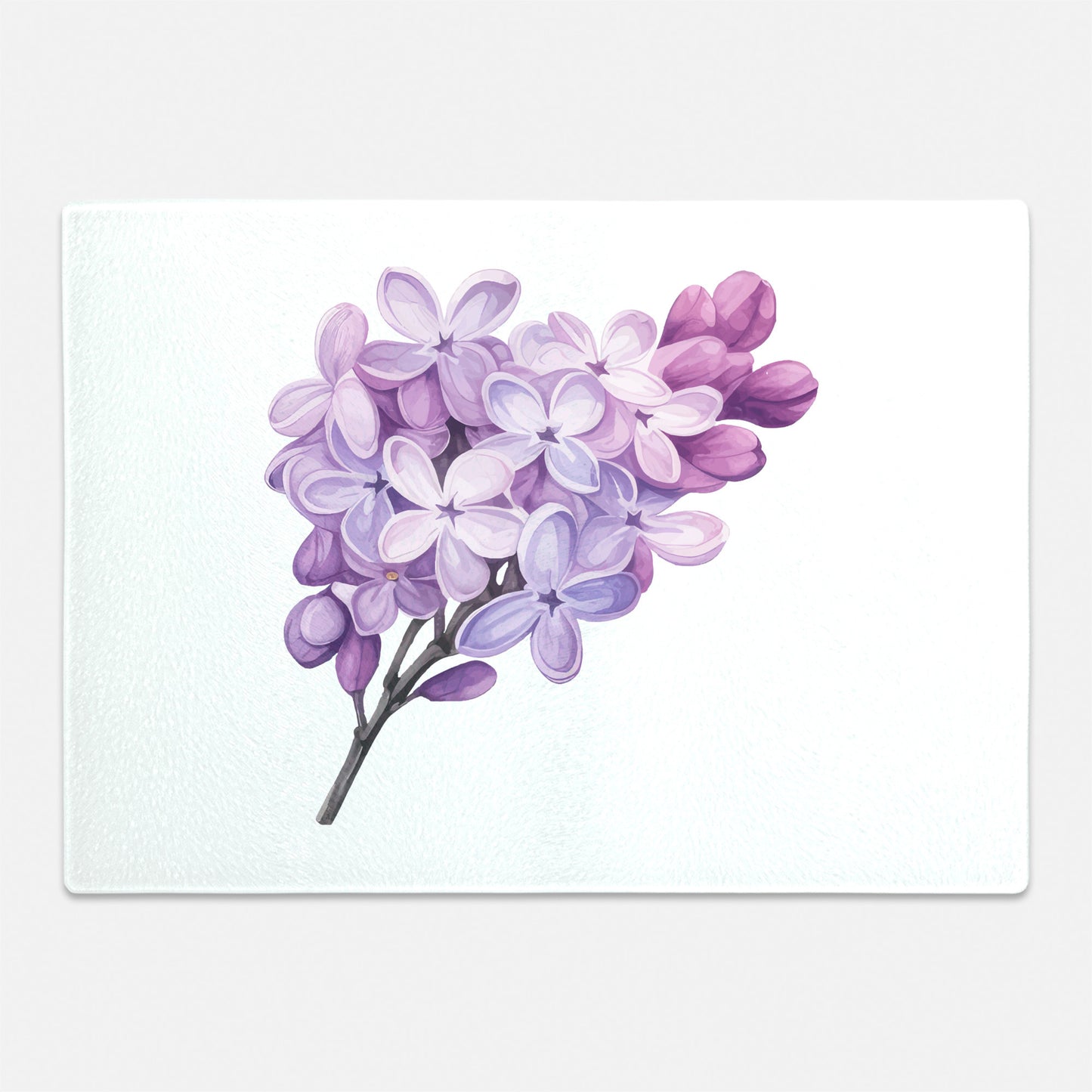 Lilac flowers on glass cutting board for gift