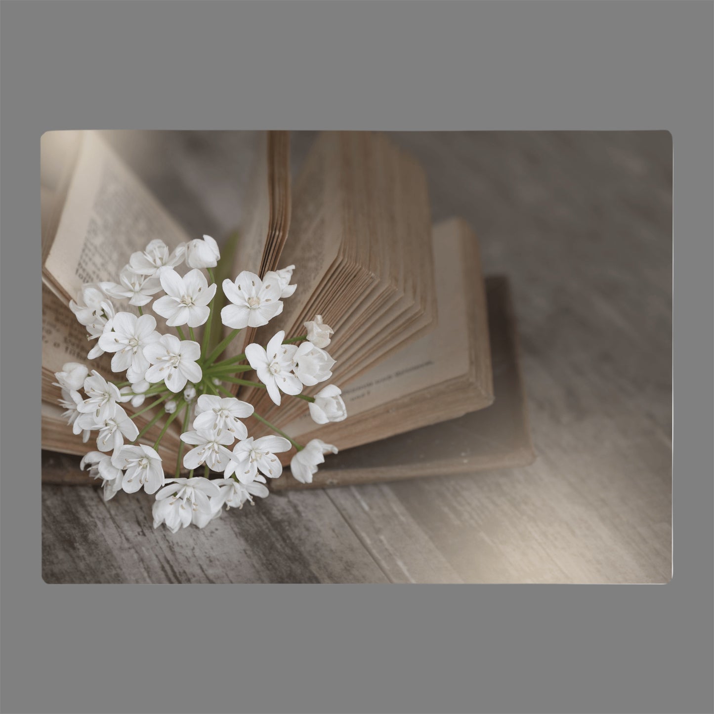 Vintage book with flowers printed on glass cutting board for gift